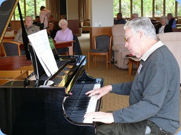 JIm Nicholson playing the grand piano. Photo courtesy of Dennis Lyons.