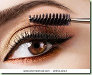 stock-photo-woman-applying-mascara-on-her-eyelashes-105544043