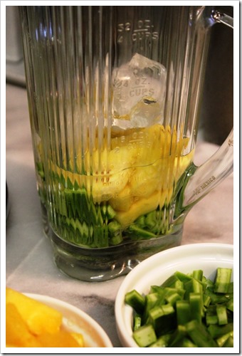 blending nopales with pineapple for green juice
