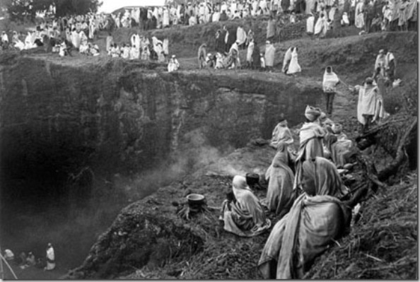 Pilgrims cooking beans during Christmas worship in the campground around Bet Madhane rock-hewn church. The basic food, always present in Amharic and Tigray people, is the INJERA made by grain called teff, cultivate in highlands.  