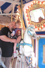 Buttonwood park 7.25.2013 Bellz and Steven riding the carousel chicken3