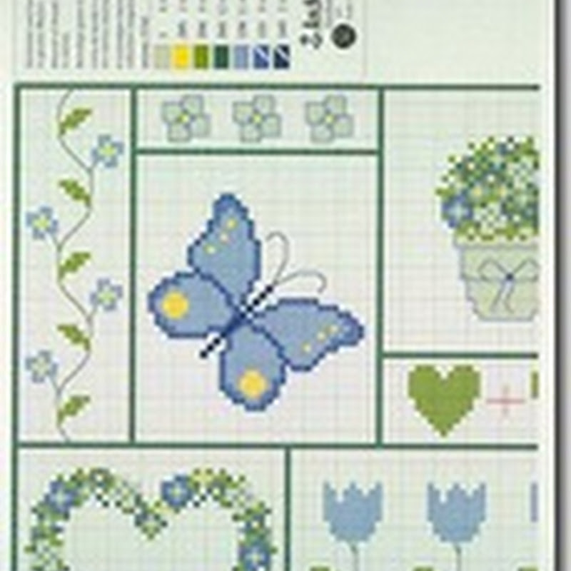 Flores y mariposas azules en punto de cruz
