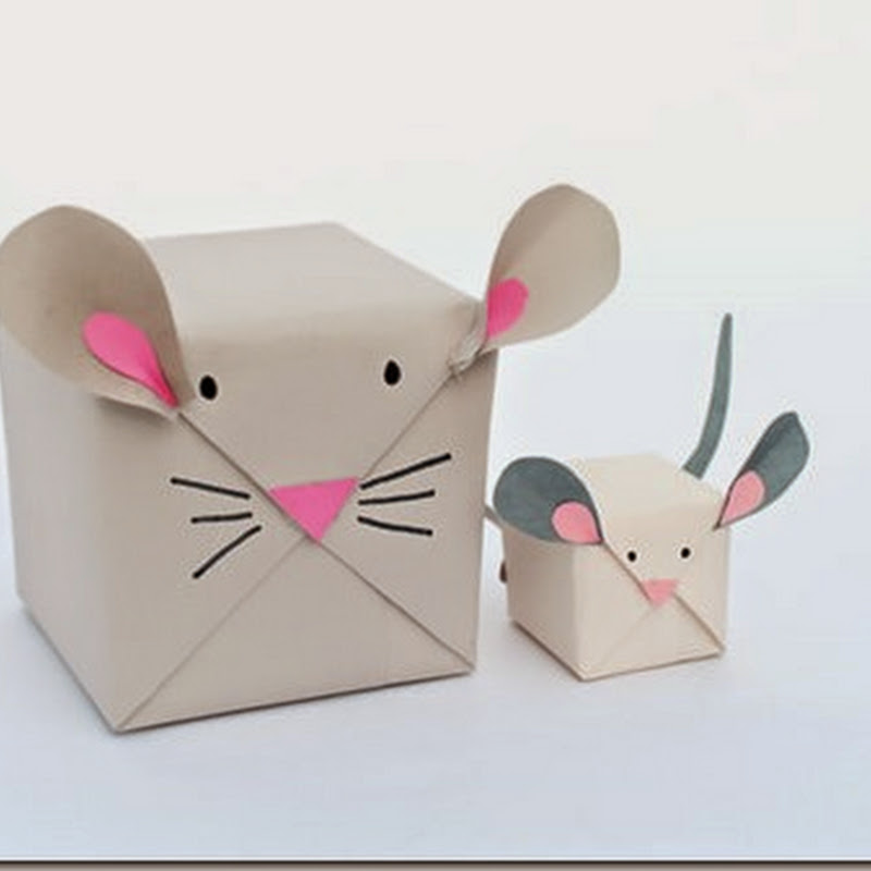 Cajas envueltas en papel blanco con forma de ratón