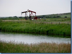 2010 Saskatchewan TC-1 East - two of many oil well pumps between Gull Lake & Webb