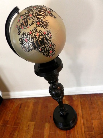 typographical art globe with upcycled pedestal
