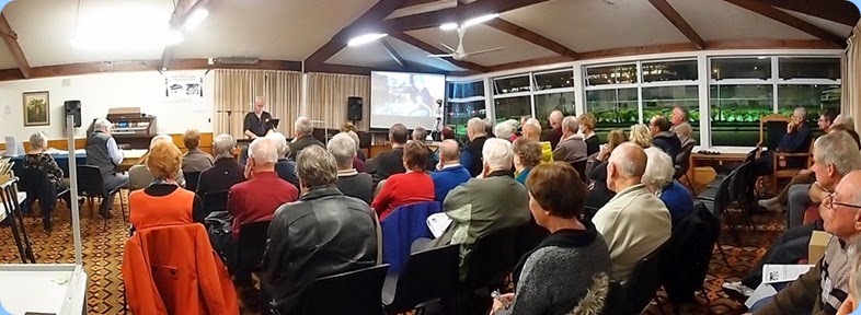 A panorama shot of the members and visitors enjoying the evening's entertainment. Photo courtesy of Dennis Lyons