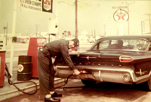 Jim Guld Sr. working at his Texaco station circa 1966