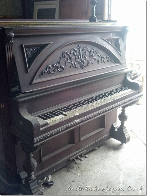 carved front upright piano