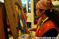 Ronald Tamfalan of the T'boli tribe paints on dagmay fabric, as part of the Kadayawan Fiesta at the Apo View Hotel