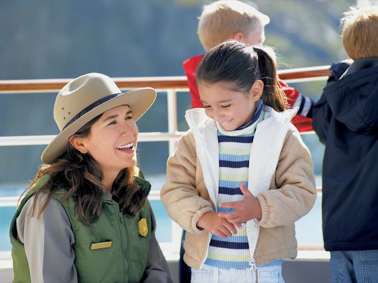 A guide has some fun with a young passenger during a Princess Cruises sailing through Alaska's Glacier Bay.