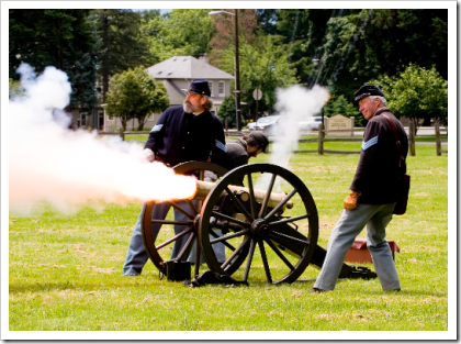 Reenactors firing a howitzer at Fort Vancouver National Park