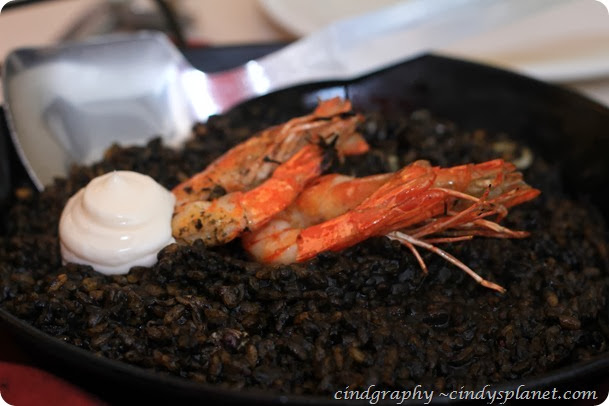 Cava’s Specialty Arroz Negro Squid Ink paella with squid and prawns with garlic aioli