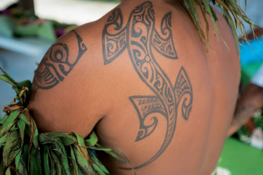 Body art: A tattoo on a native of Moorea, part of the Paul Gauguin experience.