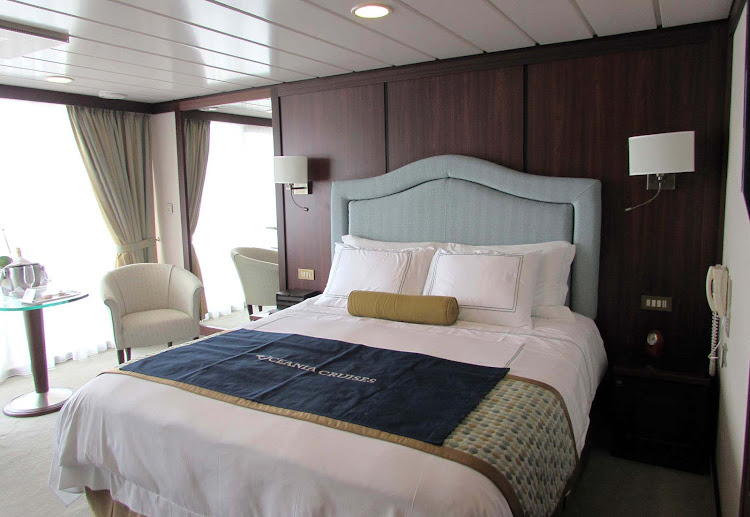 The bedroom of the Vista Suite aboard Oceania Regatta.