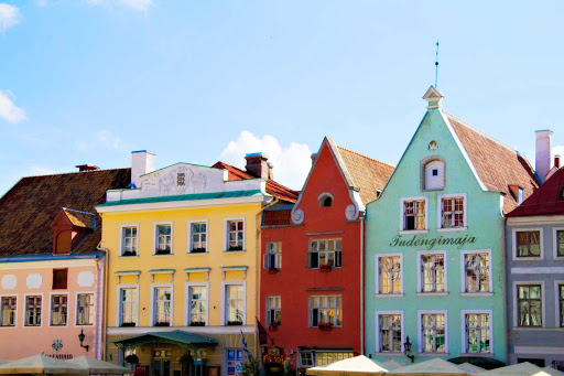 Charming, colorful shops line the streets of Tallinn, Estonia. Book a cruise to see it on Azamara Journey or Quest.