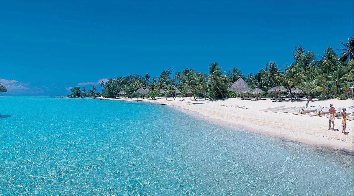 BoraBora-Beach - Bora Bora is surrounded by a barrier reef, protecting miles and miles of beautiful beaches.