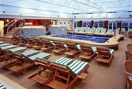 Cunard-Queen-Mary-2-Pavilion-Pool - Take a dip in the Pavilion Pool with small waterfalls and a retractable roof aboard Queen Mary 2.
