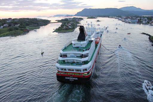 Hurtigruten-Nordnorge-in-Norway-5 - Hurtigruten's Nordnorge receives a caravan of well-wishers as she sails down the narrow peninsula into the village of Brønnøysund, Norway. 