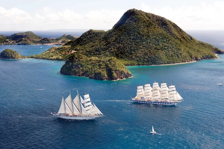 Royal Clipper leads the way for Star Clipper in exploring the Îles des Saintes near Guadeloupe in the Caribbean.