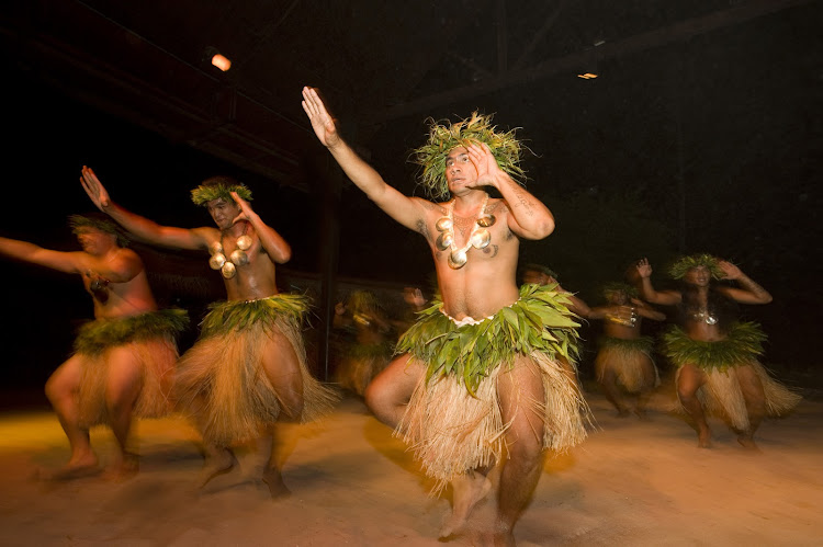 Evening entertainment on Moorea can include Tane dancers and traditional Mo'orean music.