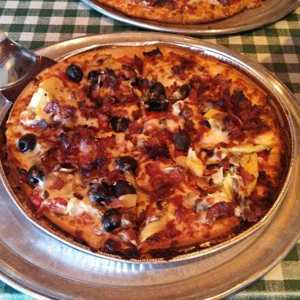 Pizza baked in its own pan.