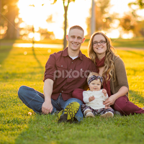 Family in the park by Marissa Frederick - People Family