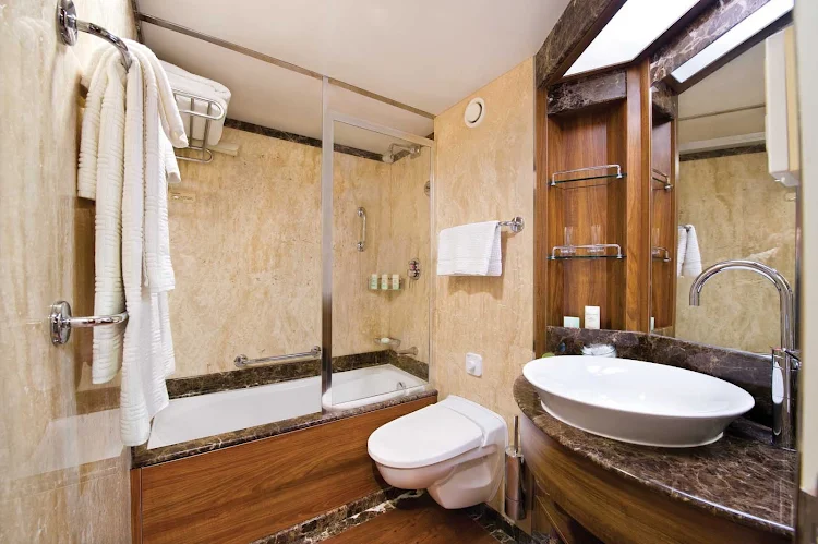 The marble bathroom and full-size bath in Silver Wind's Veranda Suite. Marble bathrooms are the standard aboard all Silversea ships.
