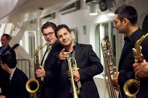 The cool cats in the Welcome Back Jazz Band entertain guests aboard an Azamara sailing to Bordeaux, France.