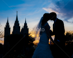 sillouetted bride and groom by Holly Johnson -  