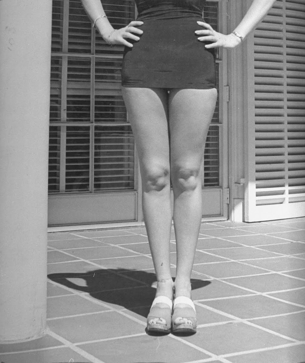 Actress Betty Grable's famous legs as she models white shorts while...