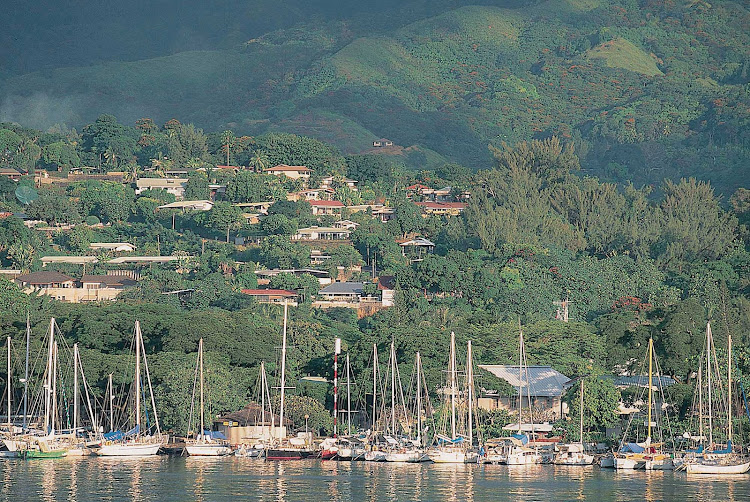 Sailors and fishermen populate the harbor at Papeete on Tahiti.