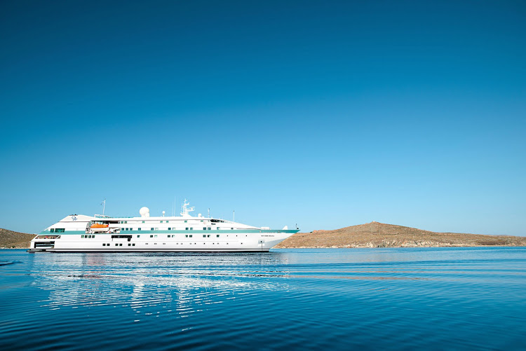 Paul Gauguin Cruises' Tere Moana anchored off the historic island of Delos, Greece.