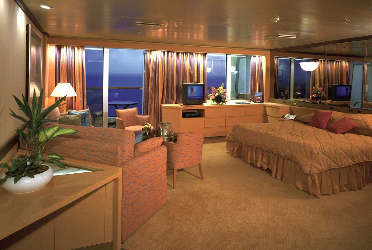Holland-America-RClass-Neptune-Suite - Relax in this cozy Neptune Suite aboard Holland America Line's Volendam.