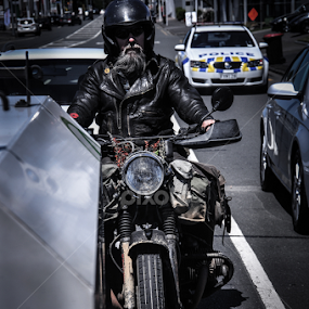 A Lone Biker by Lincoln S.L. - People Street & Candids