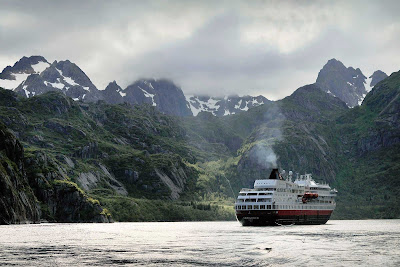 Soak in the spectacular scenery as you cruise through the Raftsundet strait aboard the Hurtigruten expedition cruise ship ms Finnmarken.