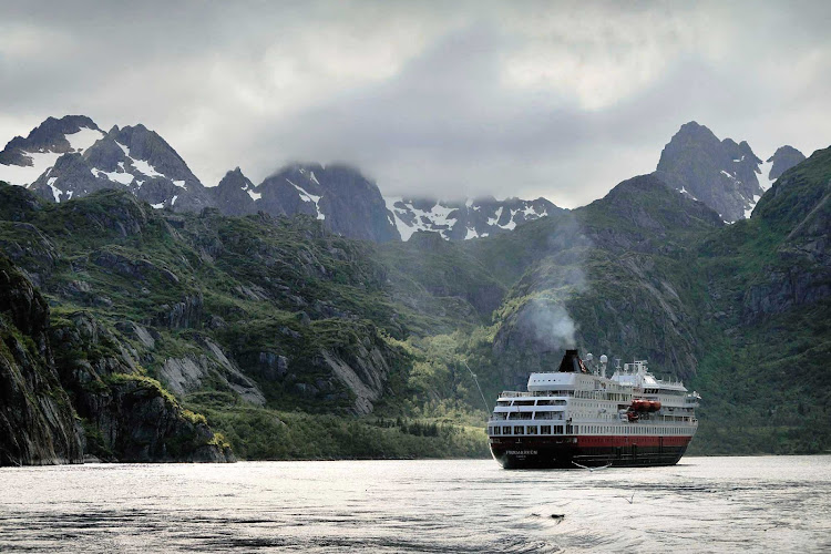 Soak in the spectacular scenery as you cruise through the Raftsundet strait aboard the Hurtigruten expedition cruise ship ms Finnmarken.