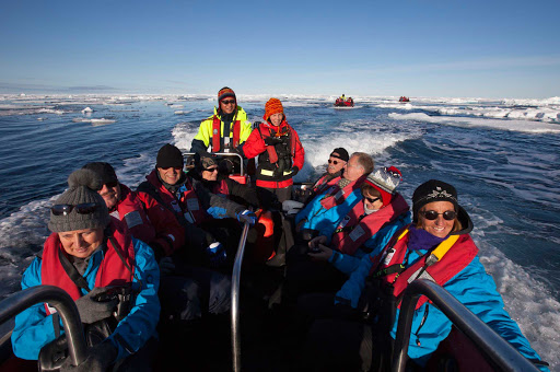 Hurtigruten-Fram-passengers-in-Svalbard - A voyage on the Hurtigruten Fram will take you to visit isolated islands, settlements and charming fishing villages of Svalbard reachable only by boat.