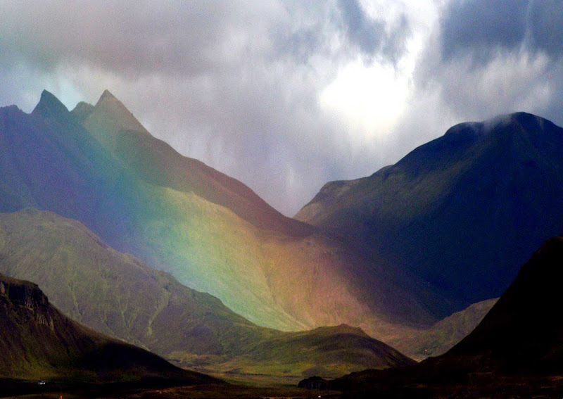 A rainbow rises out of a volcano in Iceland.