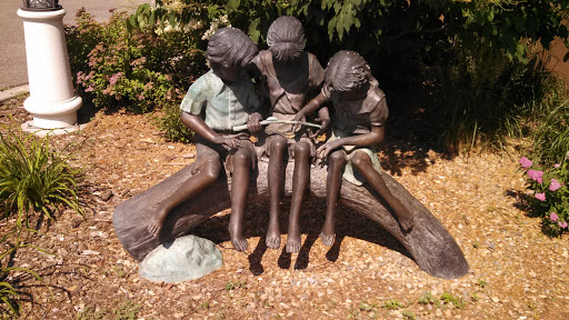 Kids with a Bug Sculpture