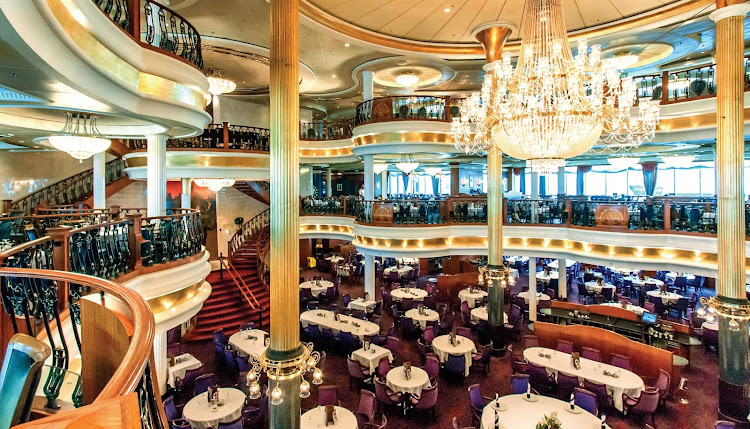 The impressive three-deck main dining room on Adventure of the Seas offers a variety of menu options for breakfast, lunch and dinner.