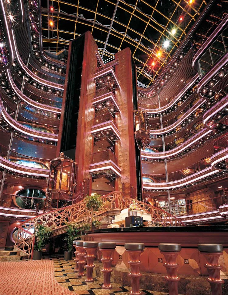 Share a cocktail as you take in Carnival Elation's eye-catching 6-story Grand Atrium.