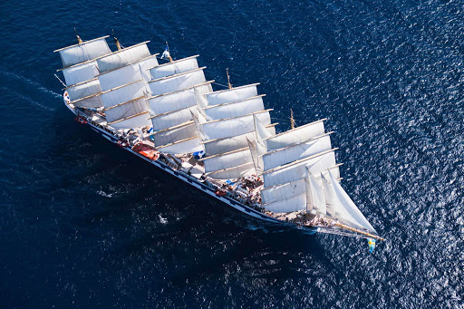 Feel the wind fill the sails of Royal Clipper during the sailing in the Caribbean. The ship switches on its engines now and then but mostly relies on wind power. 
