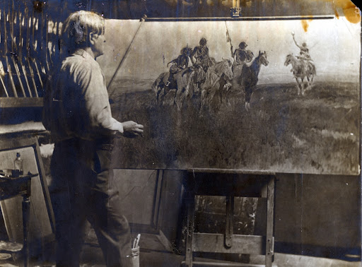 Charles Russell at easel working on The Signal Glass [Red Man's