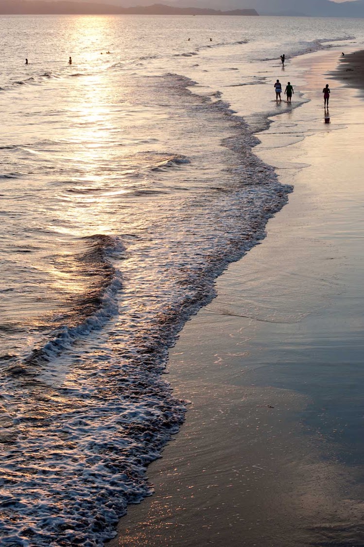 The shoreline of Puntarenas on the Pacific coast of Costa Rica at sunset. 