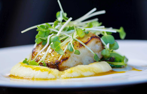 A fish and sprouts entrée at Oasis of the Seas' 150 Central Park, overseen by James Beard Award-winning chef and Miami restaurateur Michael Schwartz.
