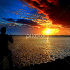 catching fish by Anthony Bagaskara - Landscapes Travel