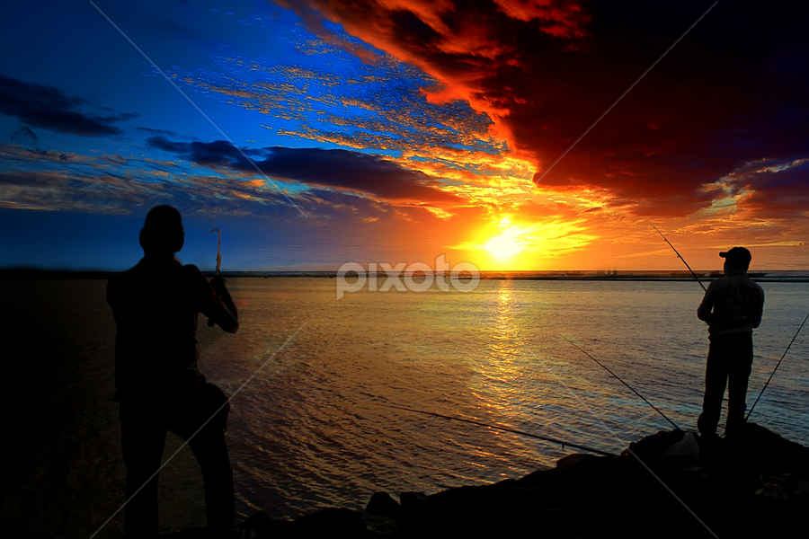 catching fish by Anthony Bagaskara - Landscapes Travel