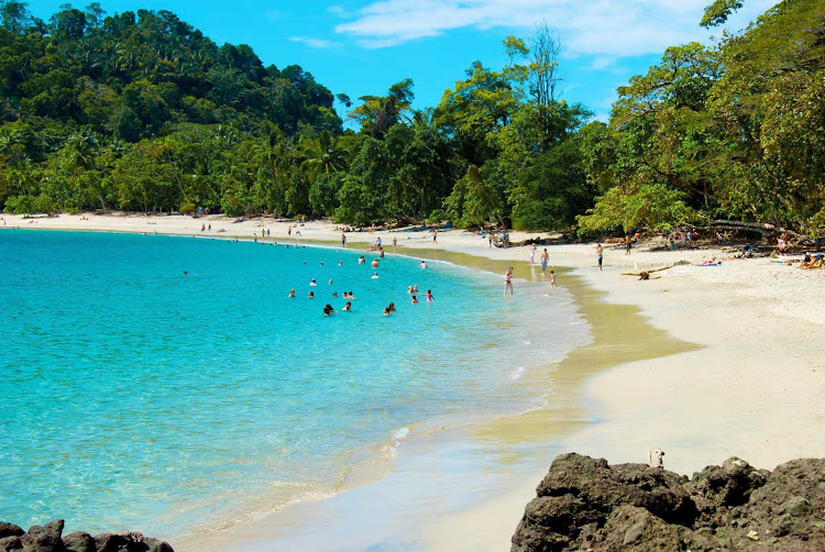 Jump in the sparkling waters of a Costa Rica beach during a Star Clippers cruise.