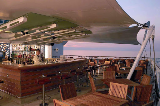 Chill out with a glass of wine and experience a magical sunset up in Celebrity Century's Sunset Bar.