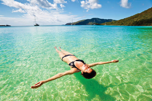 Caribbean-floating-woman - Norwegian Cruise Line brings you closer to the sparkling waters of the Caribbean.